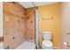 This bathroom features a shower with patterned tile walls, and a toilet with a bright yellow wall behind at 3031 N Civic Center Plz # 205, Scottsdale, AZ 85251