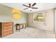 This bedroom has a ceiling fan, a window with curtains, and unique painted wall accents at 3031 N Civic Center Plz # 205, Scottsdale, AZ 85251