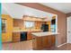 Well-lit kitchen with plenty of cabinets and adjacent eat-in bar at 3031 N Civic Center Plz # 205, Scottsdale, AZ 85251