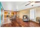 Open-concept living room features hardwood floors, eat-in kitchen, and neutral walls at 3031 N Civic Center Plz # 205, Scottsdale, AZ 85251