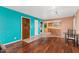 Living room features hardwood floors, an eat-in kitchen, and bright, colorful walls at 3031 N Civic Center Plz # 205, Scottsdale, AZ 85251