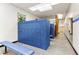 A look inside the locker room with blue lockers and bench, an inviting amenity at 3031 N Civic Center Plz # 205, Scottsdale, AZ 85251