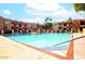 Large community swimming pool surrounded by lush landscaping and comfortable seating areas at 3031 N Civic Center Plz # 205, Scottsdale, AZ 85251