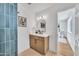 Chic powder room with stylish mirror, modern vanity, and attractive flooring at 3037 E Pueblo Ave, Mesa, AZ 85204