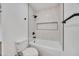The bathroom features a tile surround and black hardware and accents at 3037 E Pueblo Ave, Mesa, AZ 85204