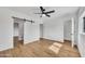 The bedroom features an en suite bathroom, barn door, and light wood-look flooring at 3037 E Pueblo Ave, Mesa, AZ 85204