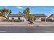 Attractive single-Gathering home with low maintenance desert landscaping, covered parking, and curb appeal at 3037 E Pueblo Ave, Mesa, AZ 85204