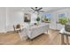 Bright living room with a large window and recessed lighting, and light wood-look flooring at 3037 E Pueblo Ave, Mesa, AZ 85204
