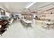 Large community room features rows of tables and chairs, kitchen and festive decor at 318 S Crismon Rd # 83, Mesa, AZ 85208