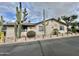Single-story home with desert landscaping, featuring saguaro cacti and ample curb appeal at 318 S Crismon Rd # 83, Mesa, AZ 85208