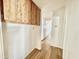 Clean hallway with wood-look flooring, leading to other parts of the home at 318 S Crismon Rd # 83, Mesa, AZ 85208