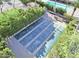 Aerial view of shuffleboard courts, a recreational amenity nestled among green hedges in the community at 318 S Crismon Rd # 83, Mesa, AZ 85208