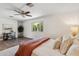 Bright bedroom features a ceiling fan, desk, white walls, and wood-look floors at 3221 N 41St Pl, Phoenix, AZ 85018