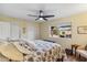 Spacious bedroom with a ceiling fan and a view of the outdoor patio through a large picture window at 3221 N 41St Pl, Phoenix, AZ 85018