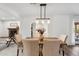 Dining room with modern lighting fixture, and access to the living room at 3221 N 41St Pl, Phoenix, AZ 85018