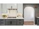Kitchen boasts gray and white cabinets, stainless steel appliances, and a modern gas range cooktop at 3221 N 41St Pl, Phoenix, AZ 85018