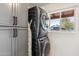 Convenient laundry area featuring a stacked washer and dryer, providing space-saving efficiency and modern amenities at 3221 N 41St Pl, Phoenix, AZ 85018
