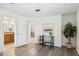 Bright office area with a desk, wood-look floors, and a view into other rooms at 3221 N 41St Pl, Phoenix, AZ 85018