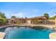 Inviting backyard pool area with patio and lush landscaping, perfect for relaxation and outdoor entertaining at 3221 N 41St Pl, Phoenix, AZ 85018