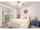 Inviting bedroom with a ceiling fan and natural light, ideal for restful nights and peaceful mornings at 3301 S Goldfield Rd # 2034, Apache Junction, AZ 85119
