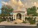 Beautiful exterior view featuring a fountain, architecture, and lush landscaping at 3301 S Goldfield Rd # 2034, Apache Junction, AZ 85119