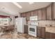 Bright kitchen with modern appliances and adjacent dining area, perfect for Gathering meals and entertaining at 3301 S Goldfield Rd # 2034, Apache Junction, AZ 85119