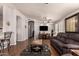 Comfortable living room with hardwood floors, neutral paint, and an open layout for easy entertaining at 3301 S Goldfield Rd # 2034, Apache Junction, AZ 85119