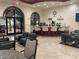 Cozy resident lounge with modern seating, coffee bar, and natural light at 3301 S Goldfield Rd # 2034, Apache Junction, AZ 85119