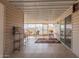 A covered patio with tile flooring, ample seating, and views of the surrounding community at 3301 S Goldfield Rd # 2034, Apache Junction, AZ 85119