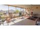 A covered and screened patio with views of the community at 3301 S Goldfield Rd # 2034, Apache Junction, AZ 85119