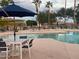 Community pool offers many chairs and tables for residents to relax and enjoy at 3301 S Goldfield Rd # 2034, Apache Junction, AZ 85119