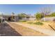 Wide angle photo of a backyard, patio, lawn and walkway around the back side of house at 3607 N 21St Ave, Phoenix, AZ 85015