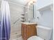 Well lit bathroom featuring tiled shower, vanity and toilet at 3607 N 21St Ave, Phoenix, AZ 85015