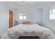 Cozy bedroom with a large window and comfortable king size bed and light blue colored walls at 3607 N 21St Ave, Phoenix, AZ 85015