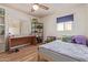 bedroom with wood floors, large desk, storage and a Minecraft themed bed at 3607 N 21St Ave, Phoenix, AZ 85015