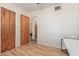 Bright bedroom with hard wood floors and wood paneled doors at 3607 N 21St Ave, Phoenix, AZ 85015
