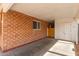 Covered carport featuring brick walls and a view of the backyard entrance at 3607 N 21St Ave, Phoenix, AZ 85015