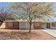 Charming brick home featuring mature trees, extended driveway, and a front porch at 3607 N 21St Ave, Phoenix, AZ 85015
