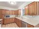 Kitchen area boasting wooden cabinets, a microwave and stainless steel dishwasher at 3607 N 21St Ave, Phoenix, AZ 85015