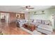 Cozy living room featuring a sectional sofa, wood floors, and exposed brick wall at 3607 N 21St Ave, Phoenix, AZ 85015