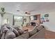 Cozy living room with brick fireplace, modern furniture, and natural light from a window at 3607 N 21St Ave, Phoenix, AZ 85015