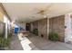 Covered patio with ceiling fans, a dining table, and views of the backyard at 3607 N 21St Ave, Phoenix, AZ 85015