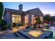 Charming backyard featuring a pool, spa, covered patio, and desert landscaping at 3634 E Sands Dr, Phoenix, AZ 85050