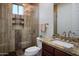 Bathroom features a walk-in shower, granite countertop, and modern fixtures at 3634 E Sands Dr, Phoenix, AZ 85050