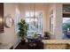 Bright breakfast nook featuring large windows with shutters and stylish lighting fixture at 3634 E Sands Dr, Phoenix, AZ 85050