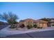 Charming home exterior with a well-manicured desert landscaped front yard, sidewalk, and two-car garage at 3634 E Sands Dr, Phoenix, AZ 85050