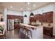 Well-equipped kitchen featuring granite countertops, dark cabinets, and stainless steel appliances at 3634 E Sands Dr, Phoenix, AZ 85050