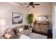 Cozy living room features a sofa, wood-look floors, a rustic cabinet, and decorative accents at 3634 E Sands Dr, Phoenix, AZ 85050