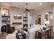 Relaxing living room showcasing a stone fireplace, light sofa and hardwood floors at 3634 E Sands Dr, Phoenix, AZ 85050