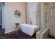 Elegant bath offers a freestanding tub, glass shower, and stylish accents at 3634 E Sands Dr, Phoenix, AZ 85050